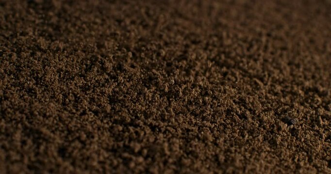 Close-Up of Fresh Ground Coffee in Slow Motion Aromatic Brown Granules, Rich Texture, and Bold Roast Perfect for Morning Rituals, Espresso Shots, and Caffeine-Lovers' Visual Inspiration at 1000 fps
