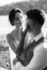 bride blonde girl and groom near the river