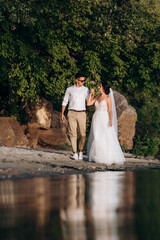bride girl and groom near the river