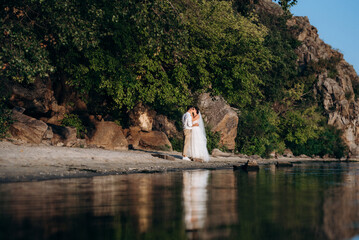 bride girl and groom near the river