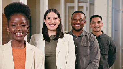 Diverse Professional Team Smiling in an Office Setting Depicting Collaboration and Teamwork in a Modern Workspace Environment