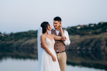 bride girl and groom near the river