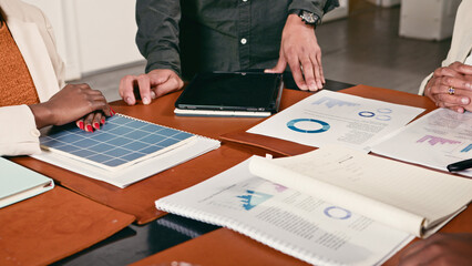 Collaborative Business Meeting Focused on Data Analysis and Strategy Planning