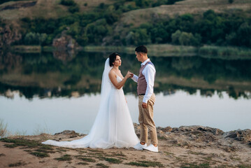 bride girl and groom near the river