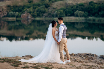bride girl and groom near the river