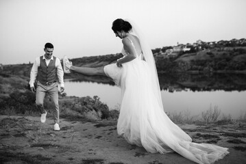 bride girl and groom near the river
