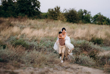 bride girl and groom near the river