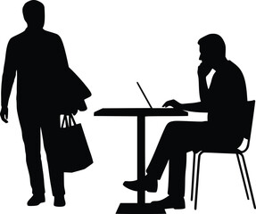 Silhouette showing one person arriving with briefcase while another works thoughtfully on laptop at desk