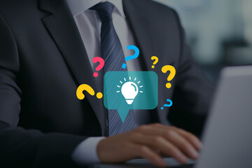 Businessman brainstorming with a lightbulb and question marks