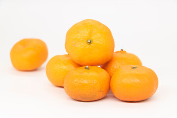Citrus or tangerina and peeled fruit on white background.
