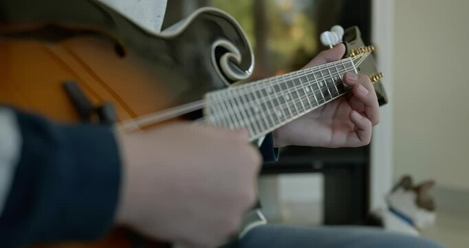 Caucasian Kid Play Mandolin at Home. European Boy Practice Music 4K 10-bit