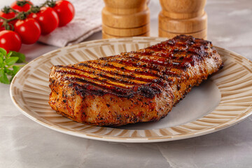 Grilled pork steak with bone