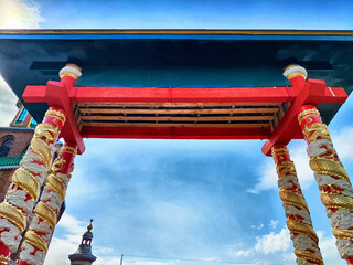 The impressive architectural features of a vibrant temple rise majestically against the backdrop of...