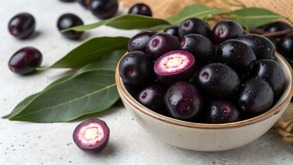 Heap of fresh Jamun berries and halved ones,food, olive, black, fruit, healthy, olives, oil, bowl, green, white, berry, ripe, sweet, fresh, isolated, diet, vegetarian, red