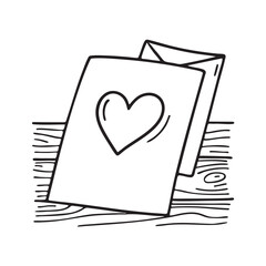 A Valentine card resting on a flat wooden surface