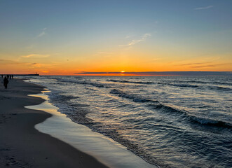 Sunset over the Baltic Sea on the beach in Mrzezyno, Poland