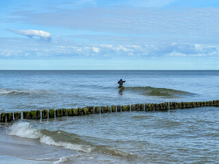 Fishing for garfish on a rod in the Baltic Sea, Mrzezyno region in Poland