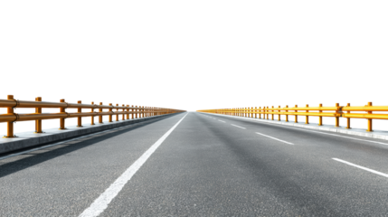 Straight road perspective with yellow barriers and clear sky at horizon.