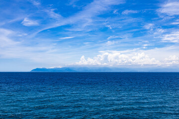 the sea surface displays varying shades of blue