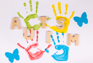 Kids handprint made of paint on white background. Autism spectrum disorder. Autism awareness
