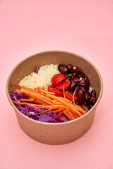 Fresh and colorful vegan salad bowl with quinoa, kidney beans, and vegetables