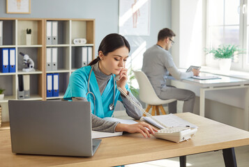 Telephone consultation, health care therapist worker at laptop online, clinic staff assistant...