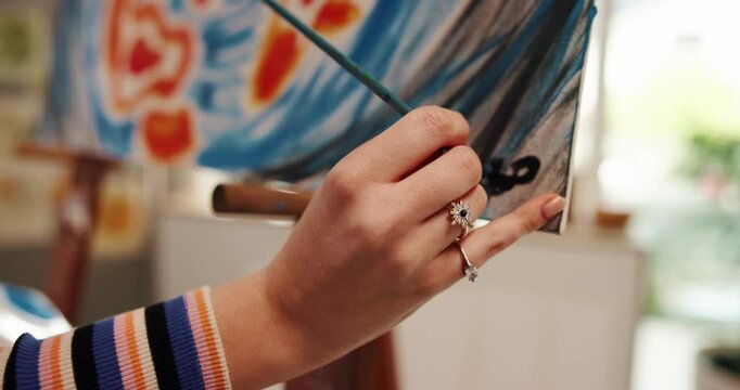Canvas, painting and hands of woman with signature for creative project, artwork and design. Painter, artist and person with paintbrush, color and tools for hobby, drawing and illustration in studio