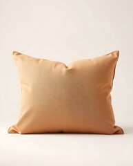 Elegant caramel colored decorative pillow isolated on neutral backdrop