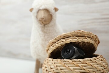 Camera hidden in wicker box, closeup. Space for text