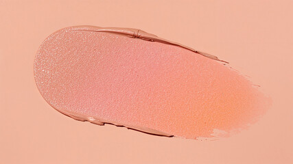 Fototapeta premium Smear of peach and pink foundation creating gradient on matching background