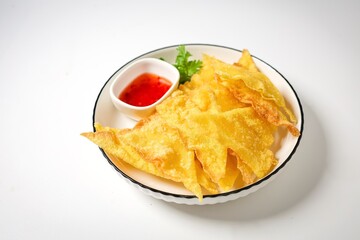 Deep Fried Wontons in white plate on white background	