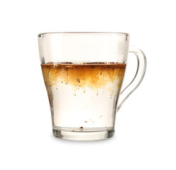 Instant coffee brewing in glass cup isolated on white