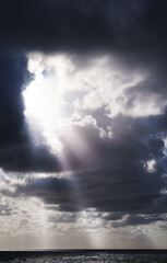 Weather background with the sun and clouds over the sea in San Sebastian, Euskadi
