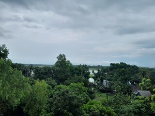 Green nature, and monsoon cloudy sky in Bangladesh. Greenery landscape with green trees. 