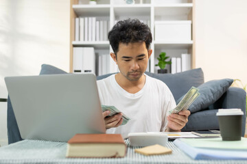 
A man spends his vacation paying bills with his laptop, coffee cups and credit cards, and he is looking for a moment to relax after all this activity.
A man spends his vacation paying bills with his
