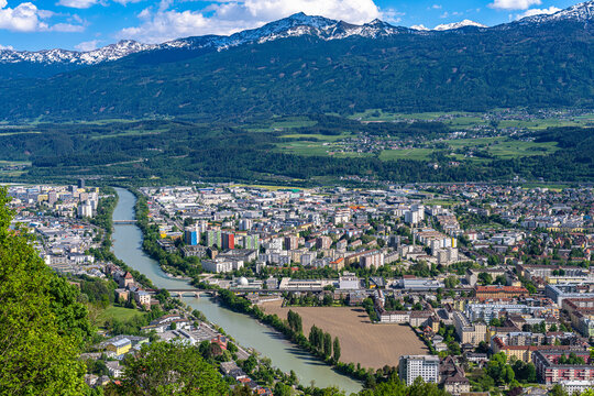 Beautiful aerial panorama view of Innsbruck city and the Tyrolean alps from Hungerburg cable car station on a sunny day in summer, Innsbruck, Tyrol, Austria