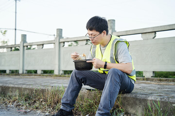 asian engineer have dinner outdoor