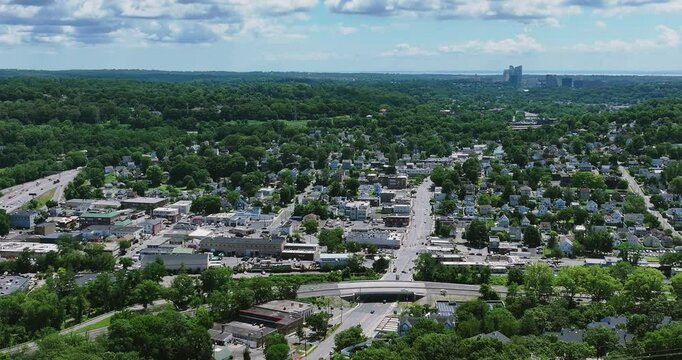 Elmsford, NY, US - July 9, 2025.  Afternoon aerial video over the Elmsford, NY, local commercial buildings and Interstate 87 and 287