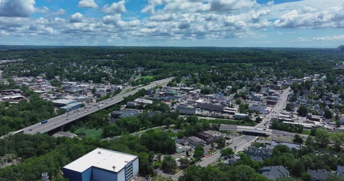 Elmsford, NY, US - July 9, 2025.  Afternoon aerial video over the Elmsford, NY, local commercial buildings and Interstate 87 and 287