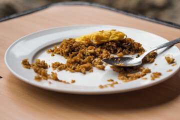 leftover fried rice on a white plate