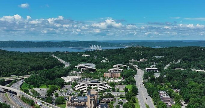 Elmsford, NY, US - July 9, 2025.  Afternoon aerial video over the Elmsford, NY, local commercial buildings and Interstate 87 and 287