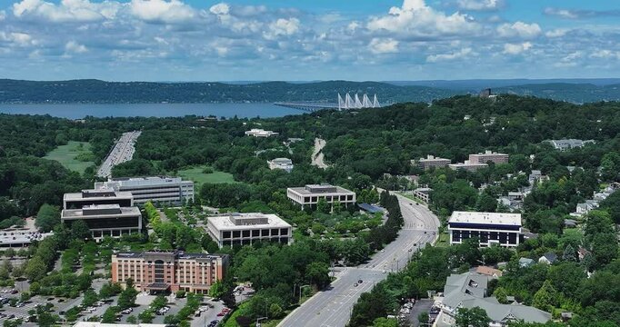 Elmsford, NY, US - July 9, 2025.  Afternoon aerial video over the Elmsford, NY, local commercial buildings and Interstate 87 and 287