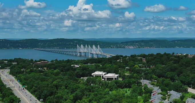 Elmsford, NY, US - July 9, 2025.  Afternoon aerial video over the Elmsford, NY, local commercial buildings and Interstate 87 and 287