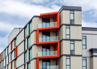 Modern residential apartment building with orange balconies in Allston, Massachusetts, USA
