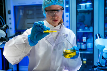 Female specialist medical laboratory scientist working with lab instrument for analyze diagnostic...
