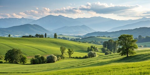 Fototapeta premium Green Fields and Distant Mountains A Hilly Landscape, Scenery, Nature