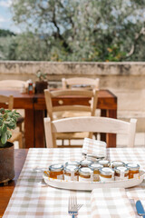 table setting in the garden, jars with honey, aesthetic summer countryside vibe