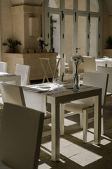 Aesthetic minimal interior of a restaurant with sunset light