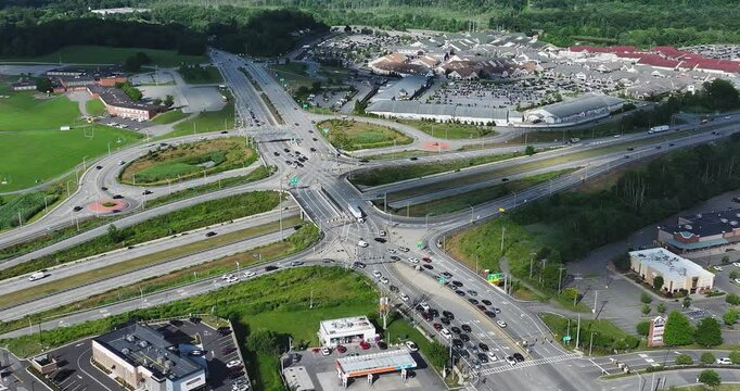 Aerial, drone, afternoon orbit video of a diverging diamond interchange (DDI), located in Woodbury, NY