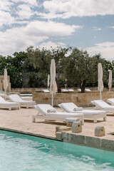 swimming pool in the luxury resort with olive trees	